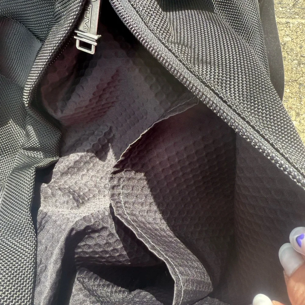 TUMI MESSENGER BAG.